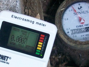 Non-wireless, old-style analog water meter emits zero radiation. Neighborhood has low levels - 0.0007 milliwatts per meter squared, or lower.